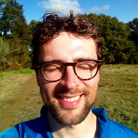 Dan smiling in pleasure with the sun on his face