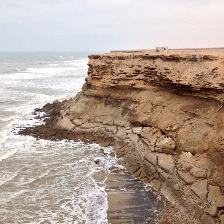 More of the same cliffs, but a military outpost (prefabricated) can be seen on top, and there are a number of fishermen huts built into the cliffs (camouflaged, so they are difficult to see).
